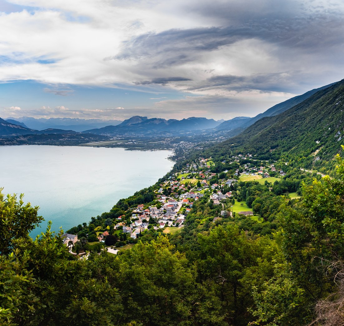 Elevated viewpoint over small French village of Bourdeau on the edge of Lake Bourget near Aix les Bains and Chambery city in Alps mountains